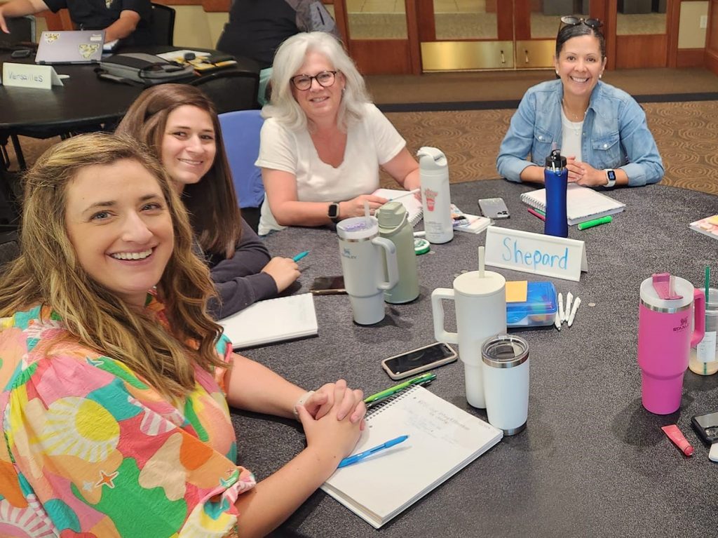 Four people working around a table