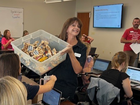 A consultant handing out gifts