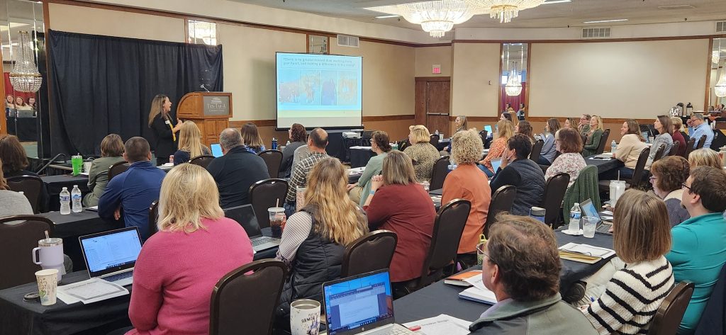 Kali Binkley presenting for a room full of educators.